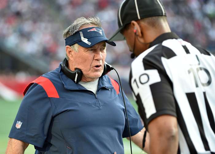 New England Patriots head coach Bill Belichick talks to the line judge against the Miami Dolphins. Mandatory Credit: Bob DeChiara-USA TODAY